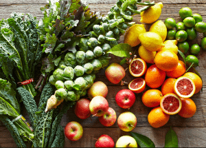 a group of fruits and vegetables on a wood surface Healthy Weight Loss Diets St Helens