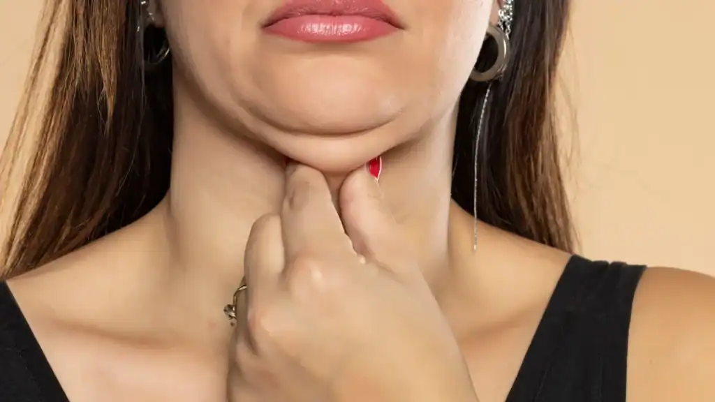 An image of a woman with double chin, sad, worried : Non Surgical Double Chin Removal Treatment in St Helens, UK